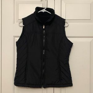 Black puffy zip up vest